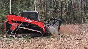 Land clearing equipment removing brush on a Porter Texas property